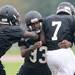 Members of the Ypsilanti Community High School football team practice in the rain at the school on Monday, August 12, 2013. Melanie Maxwell | AnnArbor.com